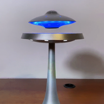 Floating LED lamp, spinning, and operating.